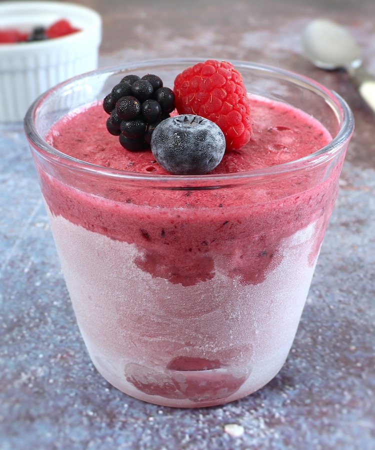Tripe berry ice cream on a glass bowl