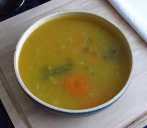 Vegetable soup with savoy cabbage on a soup bowl