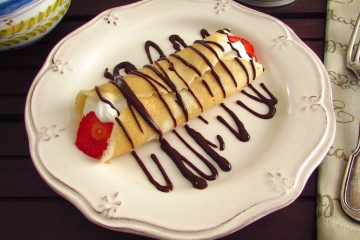 Crepe with strawberries on a plate