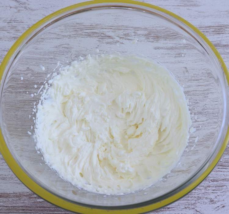 Whipped cream on a large glass bowl