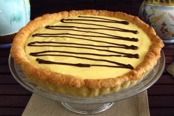 Mango pie garnished with chocolate on a plate