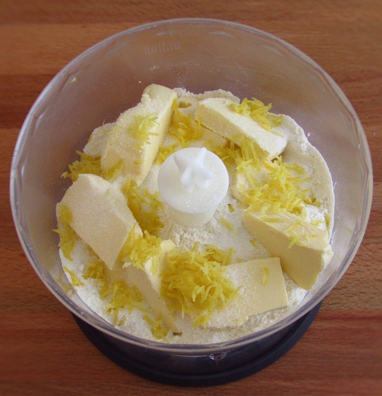 Flour, sugar, the margarine cut into cubes and the lemon zest in a food processor