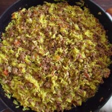 Minced meat with rice on a frying pan