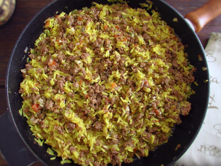 Minced meat with rice on a frying pan