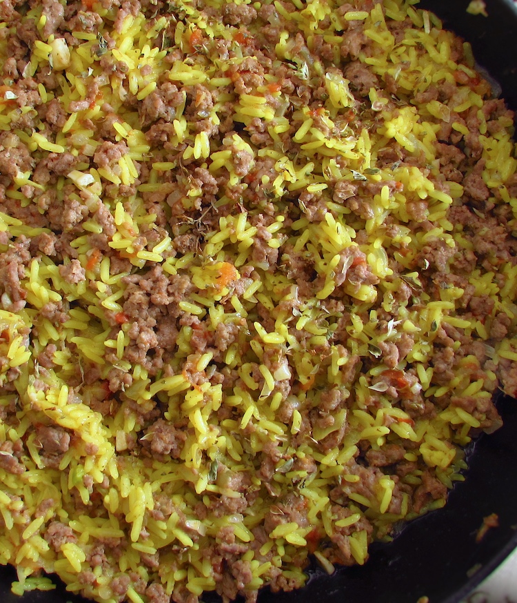 Minced meat with rice on a frying pan