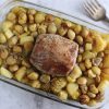 Baked pork loin with chestnuts on a glass baking dish