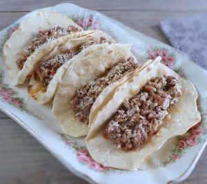 Beef and pork tacos on a platter