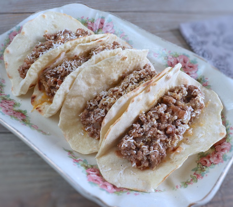Beef and pork tacos on a platter