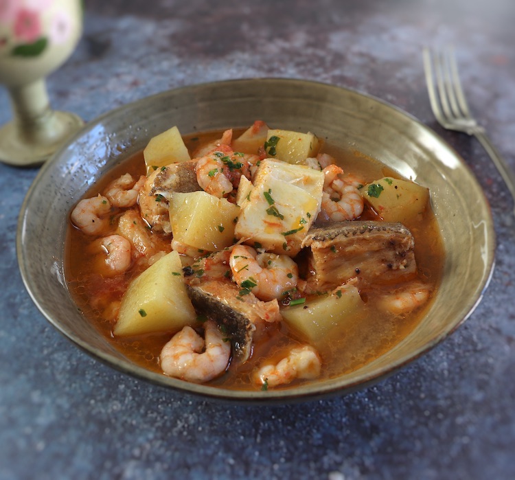 Salt cod stew with shrimp on a dish bowl