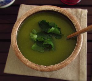 Coriander soup on a soup bowl