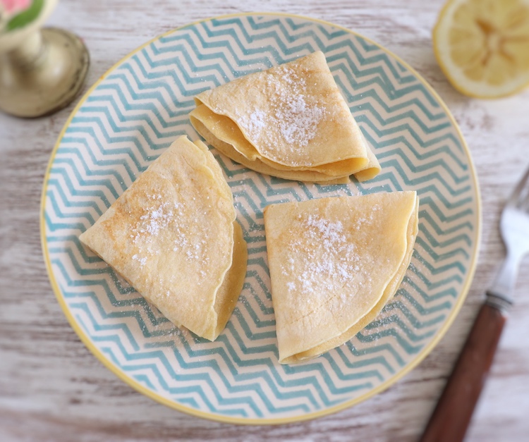 Crepes with lemon and sugar on a plate