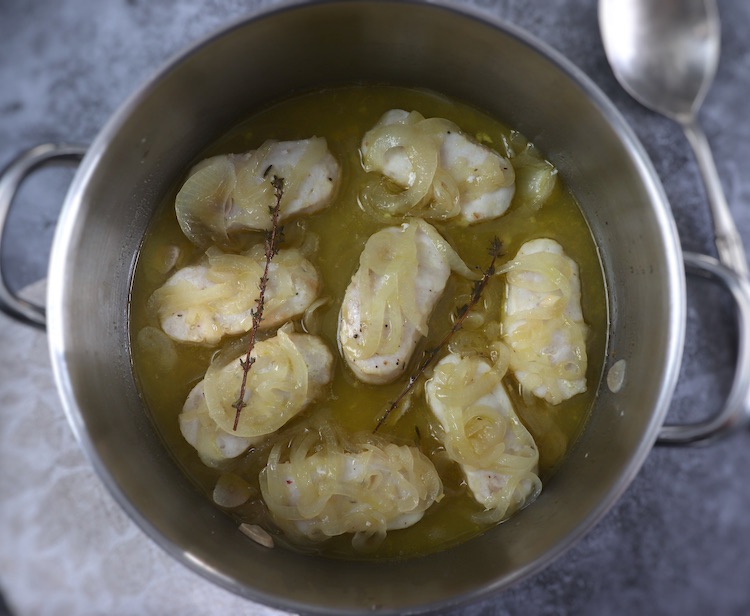 Easy fish with onion sauce on a large saucepan