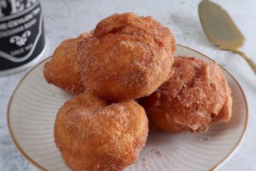 Portuguese milk doughnuts on a plate