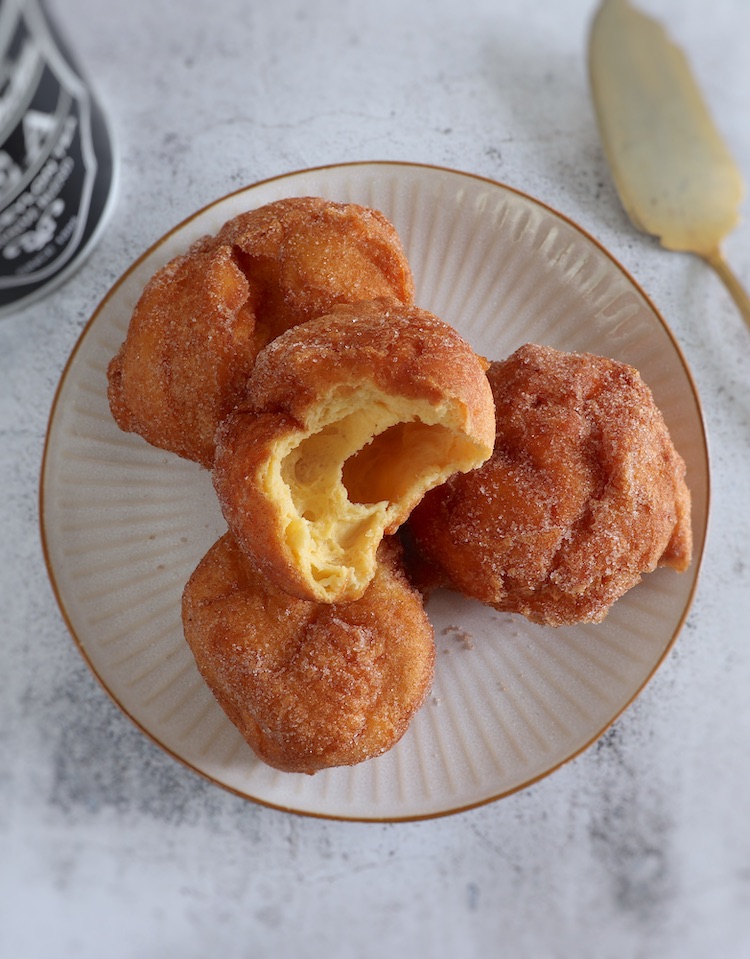 Portuguese milk doughnuts on a plate