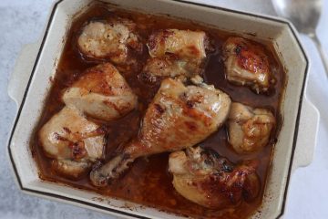 Roasted chicken with honey sauce on a baking dish