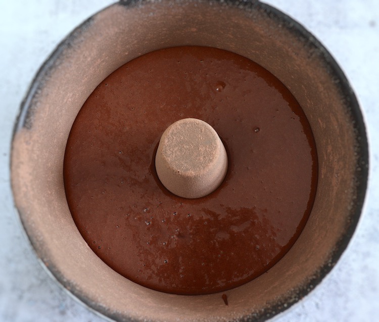 Chocolate orange cake dough on a bundt cake pan