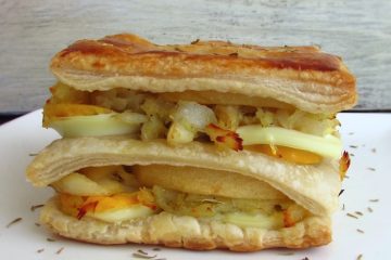 Cod, apple and egg puffs on a plate