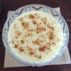 Rice pudding with condensed milk on a glass bowl