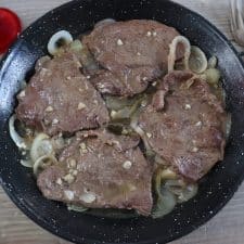 Stewed steaks on a frying pan