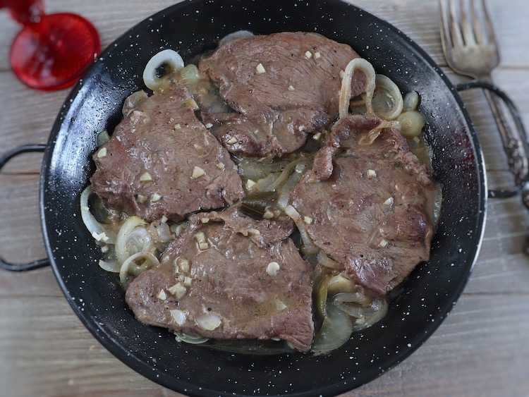 Stewed steaks on a frying pan
