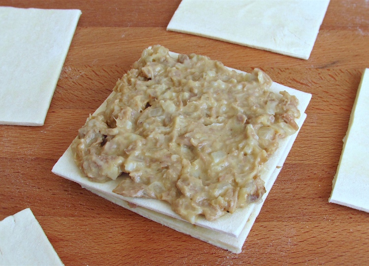 Puff pastry squares filled with tuna mixture