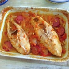 Snapper with chouriço in the oven on a baking dish