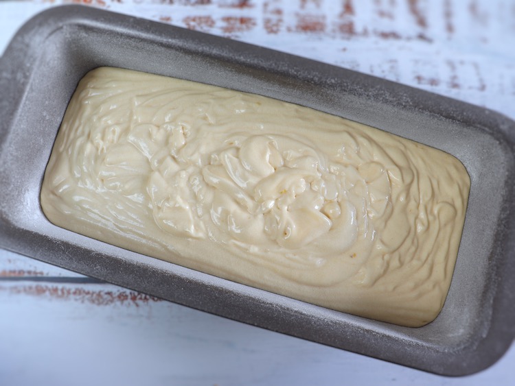 Soaked lemon cake dough on a bundt cake pan