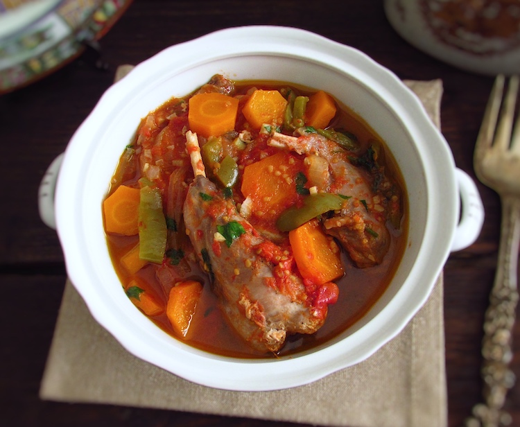 Stewed rabbit with carrots on a tureen