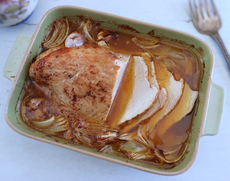 Baked turkey loin with honey on a baking dish