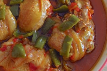 Chicken stew with peppers on a dish bowl