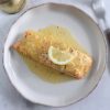 Easy baked salmon with lemon and mustard sauce on a plate