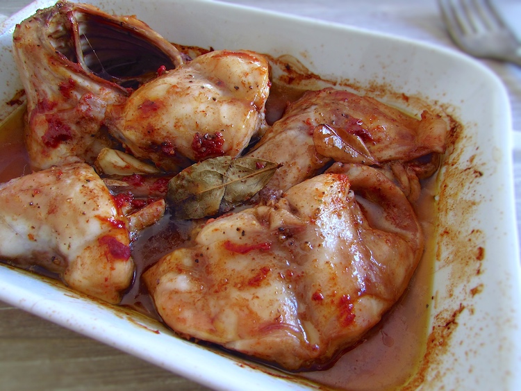 Roasted rabbit in the oven on a baking dish
