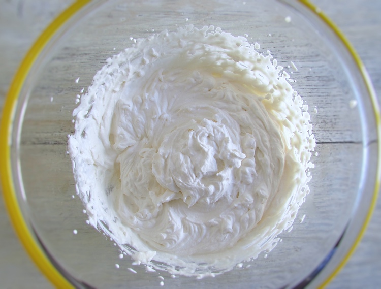 Whipped cream in a glass bowl