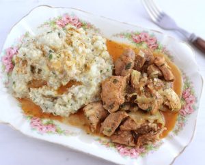 Pork with Portuguese migas (crumbs) on a platter