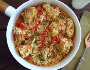 Chicken rice with peppers on dish bowl