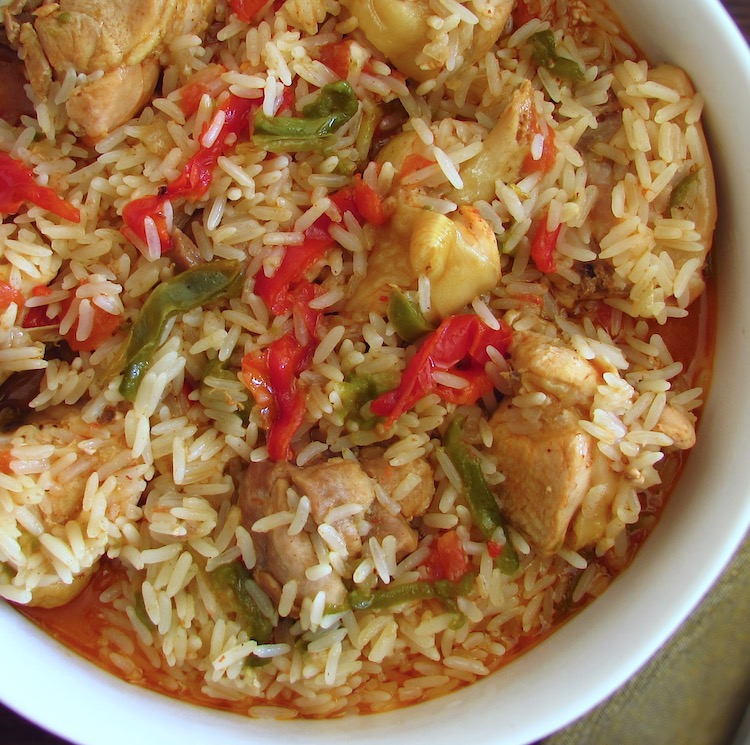Chicken rice with peppers on a dish bowl