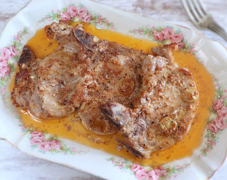 Easy oven baked pork chops on a platter