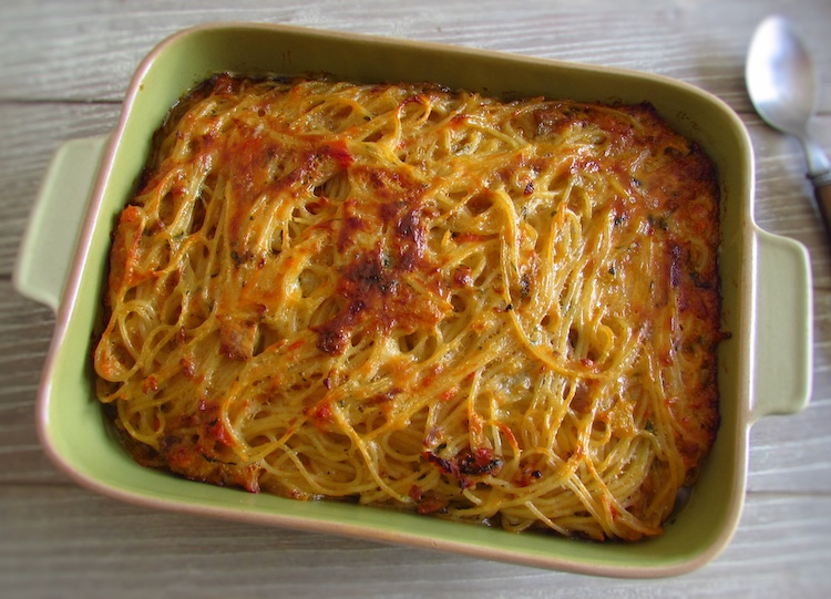 Tuna with spaghetti in the oven on a baking dish