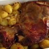 Leg of lamb in the oven on a baking dish