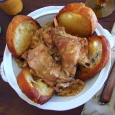 Stewed rabbit with fried bread on a tureen