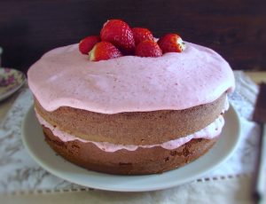 Chocolate cake with strawberry cream on a plate