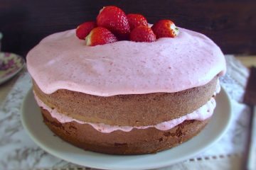 Chocolate cake with strawberry cream on a plate
