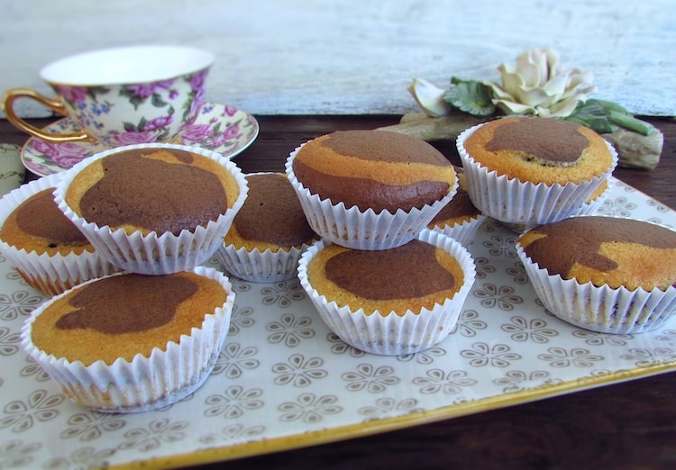 Chocolate mango marble muffins on a platter