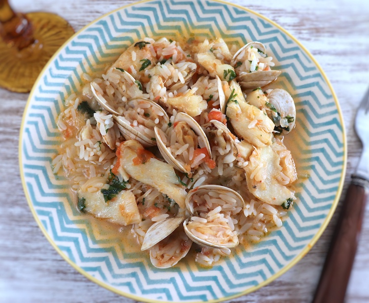 Salt cod rice with clams on a plate