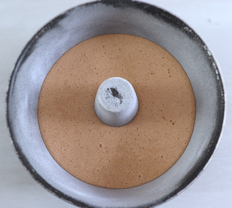 Honey and cinnamon cake dough on a bundt cake pan