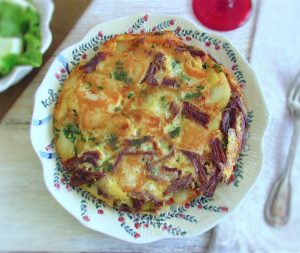 Spanish omelette with meat on a plate