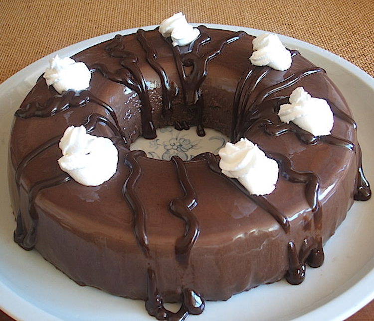 Chocolate pudding garnished with chantilly on a plate