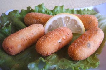 Cod croquettes with lettuce on a plate