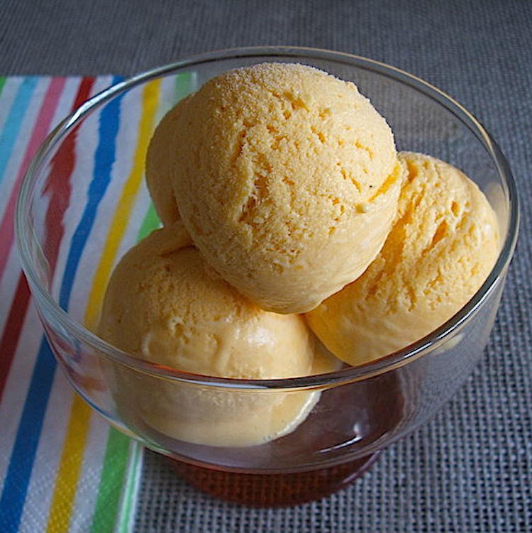Mango ice cream on a glass bowl