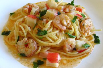 Spaghetti with shrimps and seafood delights on a plate
